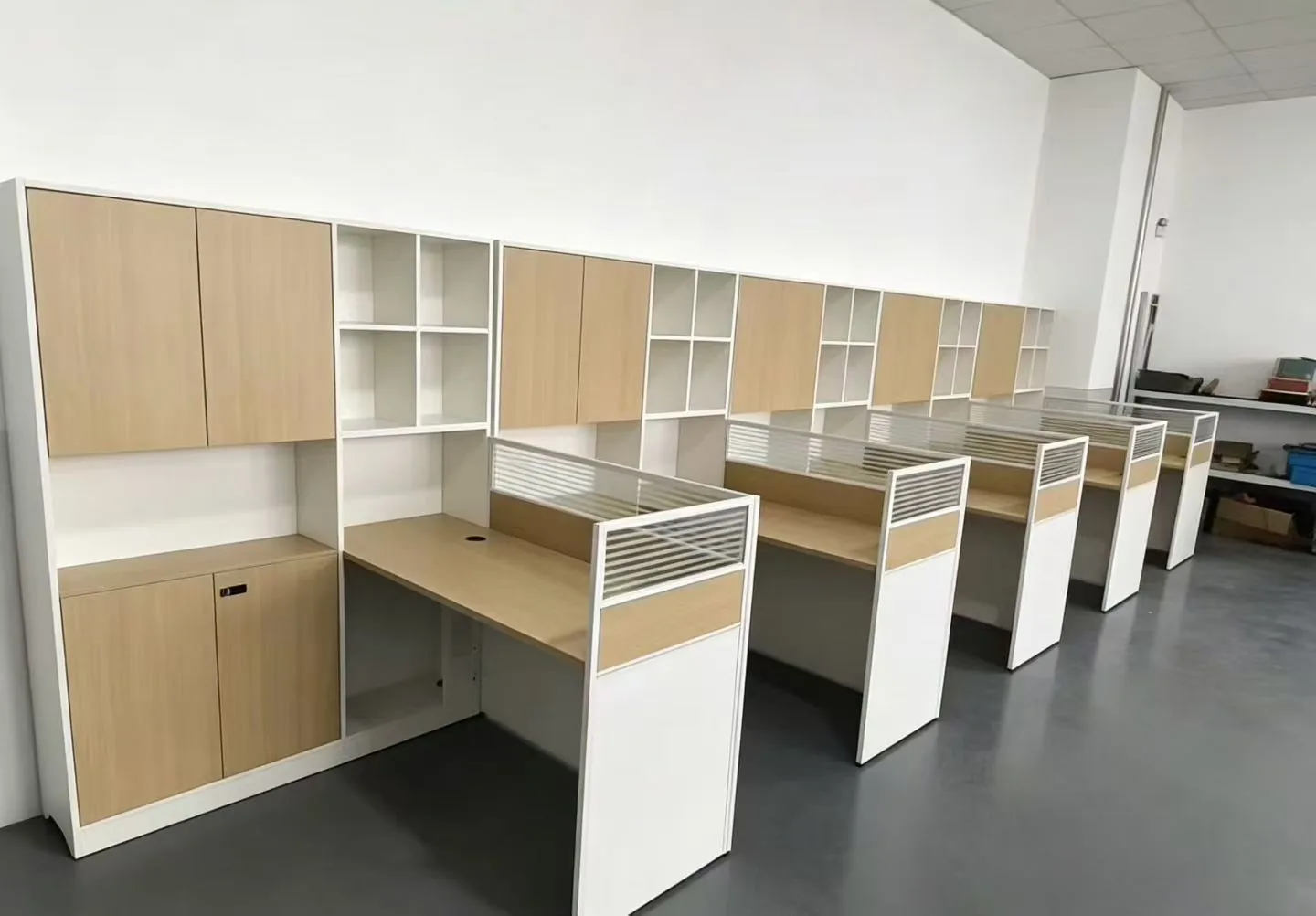 Wood-tone panel workstations with integrated storage